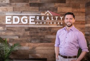 leasing housing for Somerville, Massachusetts - EDGE Realty Matt Gorman standing before EDGE masthea